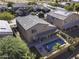 Aerial view of house with pool and solar panels at 1240 W Falls Canyon Dr, Casa Grande, AZ 85122