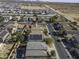 Aerial view of neighborhood with houses and solar panels at 1240 W Falls Canyon Dr, Casa Grande, AZ 85122