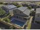 Aerial view of house with pool and solar panels at 1240 W Falls Canyon Dr, Casa Grande, AZ 85122