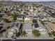 Aerial view of neighborhood with houses and solar panels at 1240 W Falls Canyon Dr, Casa Grande, AZ 85122