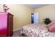 Bedroom with double bed and red armoire at 1240 W Falls Canyon Dr, Casa Grande, AZ 85122