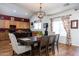 Dining area with wood table and chairs, and kitchen view at 1240 W Falls Canyon Dr, Casa Grande, AZ 85122