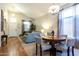 Bright dining area with wood flooring and a chandelier at 1240 W Falls Canyon Dr, Casa Grande, AZ 85122