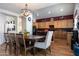 Dining area with wood table and chairs, and kitchen view at 1240 W Falls Canyon Dr, Casa Grande, AZ 85122