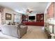 Spacious living room featuring built-in shelving and a cozy seating area at 1240 W Falls Canyon Dr, Casa Grande, AZ 85122