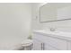 Half bathroom with a vanity and a toilet at 12474 W Redfield Rd, El Mirage, AZ 85335