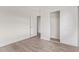 Bedroom featuring light wood flooring and a closet at 12474 W Redfield Rd, El Mirage, AZ 85335