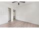 Bedroom featuring light wood flooring and a closet at 12474 W Redfield Rd, El Mirage, AZ 85335