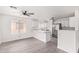 Light and airy kitchen featuring white cabinets, quartz countertops, and stainless steel appliances, a chef's dream at 12474 W Redfield Rd, El Mirage, AZ 85335