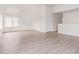 Spacious living room featuring light wood flooring at 12474 W Redfield Rd, El Mirage, AZ 85335