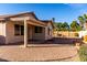 Backyard with covered patio and brick pavers at 12962 W Catalina Dr, Avondale, AZ 85392