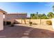 Desert landscaping with stone pathway, small table, and rock accents at 12962 W Catalina Dr, Avondale, AZ 85392