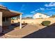 Backyard with covered patio and brick pavers at 12962 W Catalina Dr, Avondale, AZ 85392