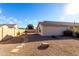 Backyard features a stone path, gravel, and rock accents at 12962 W Catalina Dr, Avondale, AZ 85392