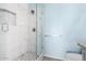 Bathroom with a large walk-in shower and marble tile at 12962 W Catalina Dr, Avondale, AZ 85392