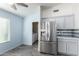 Kitchen with stainless steel appliances and a view of the laundry area at 12962 W Catalina Dr, Avondale, AZ 85392