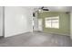 Living room with neutral walls, carpet, and access to the backyard at 12962 W Catalina Dr, Avondale, AZ 85392