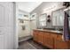 Elegant bathroom with double vanity and walk-in shower at 13353 W Port Royale Ln, Surprise, AZ 85379