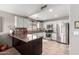 Modern kitchen with stainless steel appliances and ample counter space at 13353 W Port Royale Ln, Surprise, AZ 85379