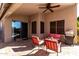 Relaxing patio with seating area, ceiling fan, and grill at 13353 W Port Royale Ln, Surprise, AZ 85379