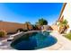 Enjoy this private backyard oasis with a sparkling pool and spa at 13353 W Port Royale Ln, Surprise, AZ 85379