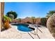 Inviting kidney-shaped pool with spa and ample patio space at 13353 W Port Royale Ln, Surprise, AZ 85379