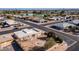 Aerial view showing a single-story home near a golf course at 14202 N Lakeforest Dr, Sun City, AZ 85351