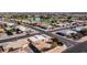 Aerial view of a single story home located near a golf course and lake at 14202 N Lakeforest Dr, Sun City, AZ 85351