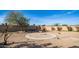 Desert landscape backyard with a circular gravel area at 14202 N Lakeforest Dr, Sun City, AZ 85351