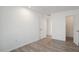 Simple bedroom with wood-look flooring and a closet at 14202 N Lakeforest Dr, Sun City, AZ 85351