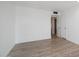 Bright bedroom with wood-look floors and neutral walls at 14202 N Lakeforest Dr, Sun City, AZ 85351