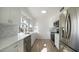 Updated kitchen featuring white shaker cabinets and quartz countertops at 14202 N Lakeforest Dr, Sun City, AZ 85351