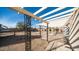 Backyard patio with pergola and access to the house at 14202 N Lakeforest Dr, Sun City, AZ 85351