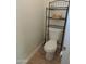 Convenient half-bathroom with storage shelving at 1435 S Spartan St, Gilbert, AZ 85233