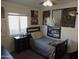 Small bedroom with twin bed, nightstand, and anime posters at 1435 S Spartan St, Gilbert, AZ 85233