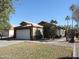 House exterior showcasing a two-car garage and landscaping at 1435 S Spartan St, Gilbert, AZ 85233