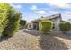 Landscaped backyard with gravel and mature shrubs at 14408 W Corral Dr, Sun City West, AZ 85375