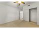 Bright bedroom with ceiling fan and large closet at 14408 W Corral Dr, Sun City West, AZ 85375