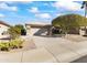 Single-story home with a two-car garage and desert landscaping at 14408 W Corral Dr, Sun City West, AZ 85375