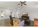 Spacious living room featuring a fireplace and large TV at 14408 W Corral Dr, Sun City West, AZ 85375