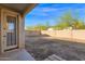 Backyard with block wall and access door at 15466 W Laurel Ln, Surprise, AZ 85379