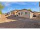 Spacious backyard with gravel and block wall at 15466 W Laurel Ln, Surprise, AZ 85379