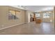 Bright dining area with tile floors and kitchen views at 15466 W Laurel Ln, Surprise, AZ 85379