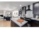 Modern kitchen with black cabinets, white quartz countertops, and herringbone backsplash at 1638 E Hackamore St, Mesa, AZ 85203