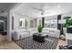 Modern living room featuring light colored sectional sofa and geometric rug at 1638 E Hackamore St, Mesa, AZ 85203