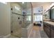 Spa-like bathroom with a large glass shower and modern vanity at 16464 W Piccadilly Rd, Goodyear, AZ 85395