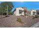 Single-story home with desert landscaping and a two-car garage at 16464 W Piccadilly Rd, Goodyear, AZ 85395