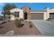 One-story home with arched entryway and desert landscaping at 16464 W Piccadilly Rd, Goodyear, AZ 85395