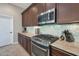 Modern kitchen with stainless steel appliances and granite countertops at 16464 W Piccadilly Rd, Goodyear, AZ 85395