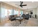 Relaxing living room with comfortable seating and large windows at 16464 W Piccadilly Rd, Goodyear, AZ 85395